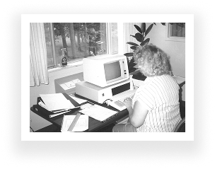 Woman on 1980s computer