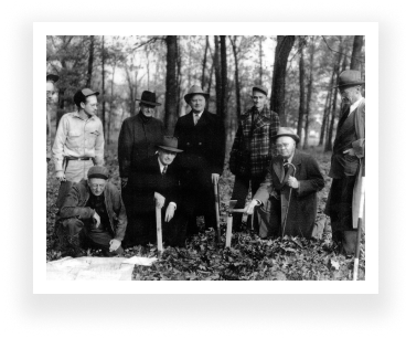 men standing in woods
